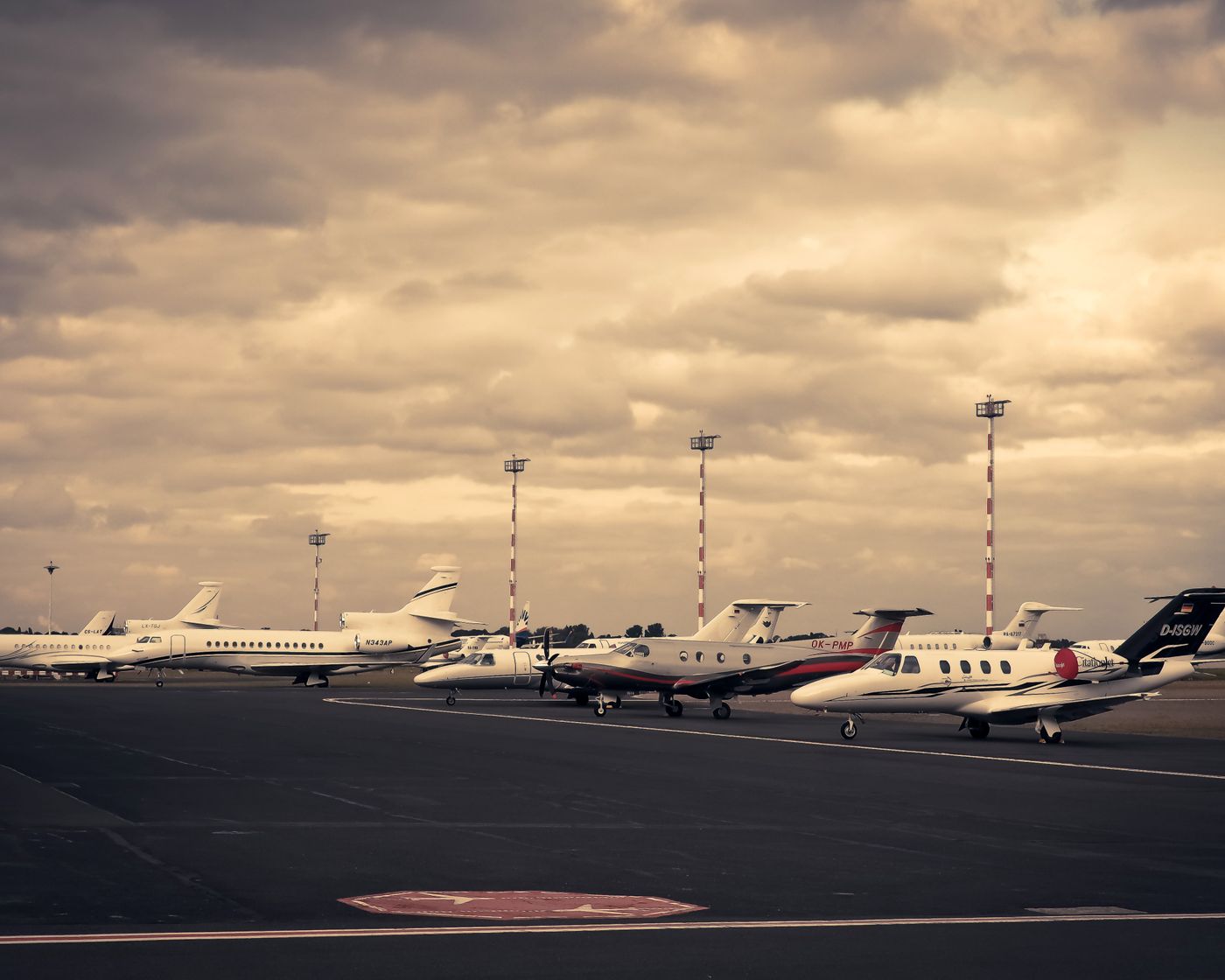 Private jets on the ramp at dusk